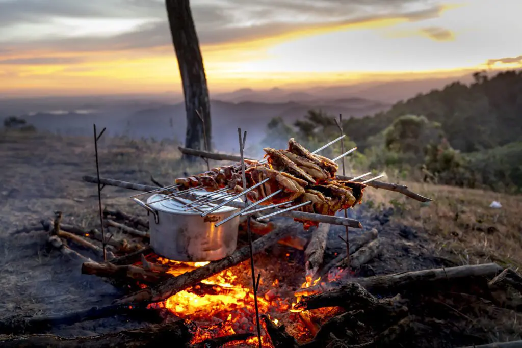 Cooking Meats for Backpacking over a fire with a great mountain view