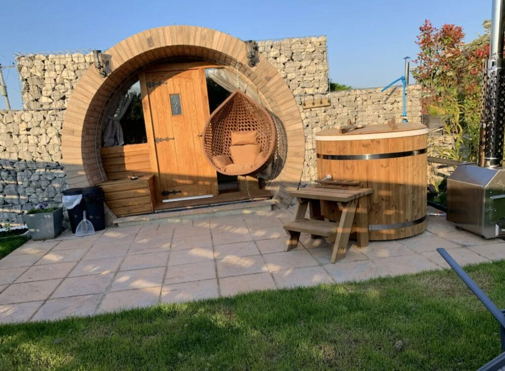 A hobbit-hole like entrance.. This is one of the lodges with hot tubs in Kent.