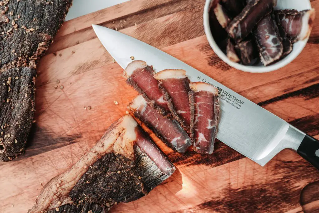 Biltong slices on a wooden board