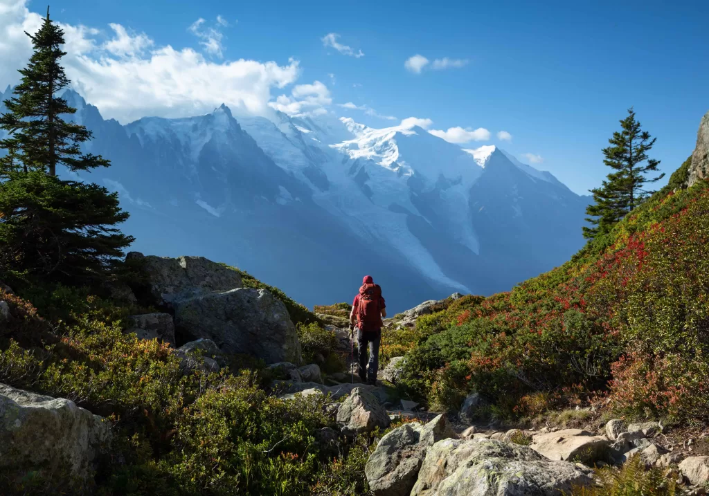 A backpacker backpacking in the high mountains - hopefully with cheese in his bag