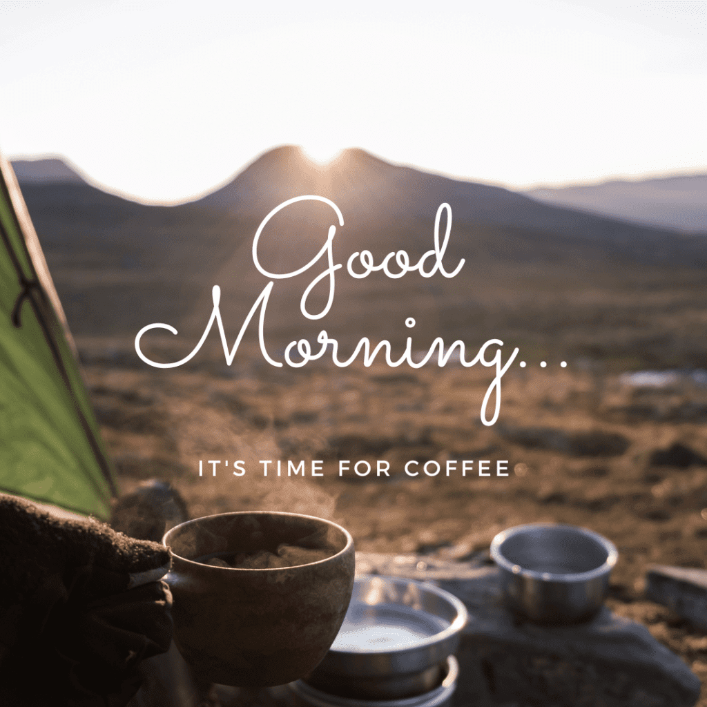 A cup of best instant coffee backpacking in a green tent. There is a pan in the background and the sun is rising over a desert landscape with a mountain in the back.