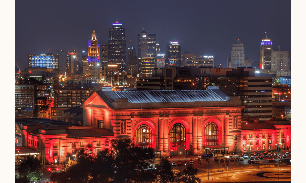 This photo shows the skyline of the city at night, a view that is one of the best dates in Kansas City.