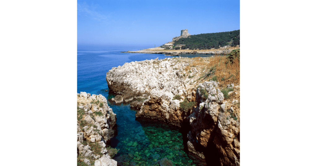 Port Badisco - Best Beaches in Puglia - A rocky cove set against a blue sea